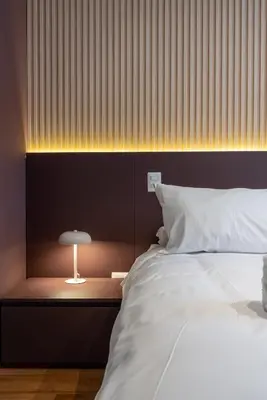 a bedroom with a bed and a lamp on a table at Brickell 2BR by Geko in Lima