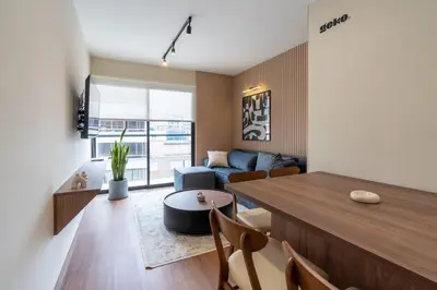 a living room with a table and a couch at Brickell 2BR by Geko in Lima