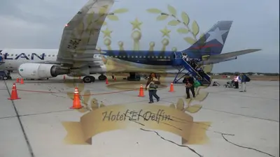 a group of people walking towards an airplane at Hotel El Delfin in Lima