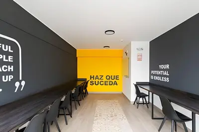 a conference room with chairs and a yellow wall at Torre Black in Lima