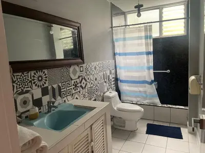 a bathroom with a sink and a toilet at Miraflores Dpto 3 dormitorios in Lima