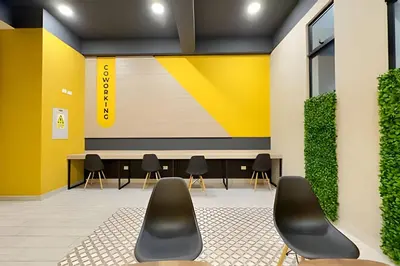 a waiting area with chairs and a table in a building at Torre Gold in Lima