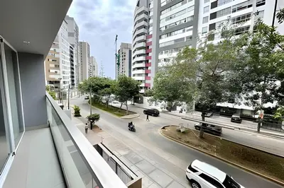 a view of a city street with a white car at Modern Apartment between Miraflores & Surquillo in Lima