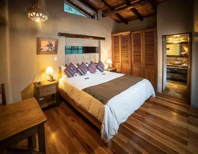 a bedroom with a large bed in a room at Dreamy cabins in Urubamba