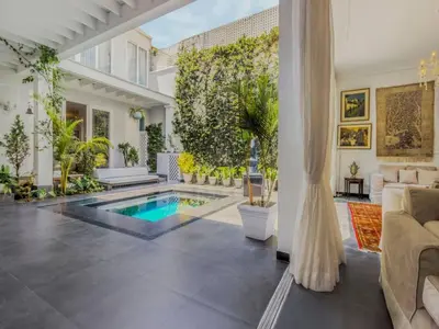a living room with a pool in the middle at Apartment in the historic central of the city in Cusco