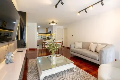 a living room with a couch and a table at Montclair 2BR by Geko in Lima