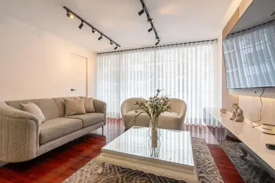 a living room with a couch and a table at Montclair 2BR by Geko in Lima