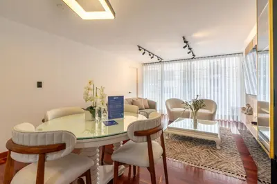 a dining room with a table and chairs at Montclair 2BR by Geko in Lima