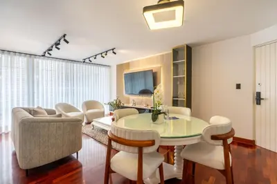 a living room with a table and chairs at Montclair 2BR by Geko in Lima