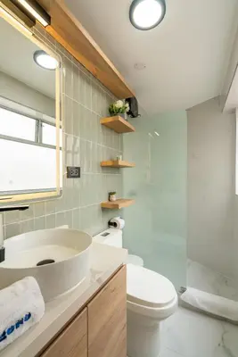a bathroom with a sink and a toilet at Montclair 2BR by Geko in Lima