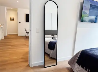 a mirror in a bedroom with a bed at New 2D with Pool-Coworking-Gym in Miraflores in Lima