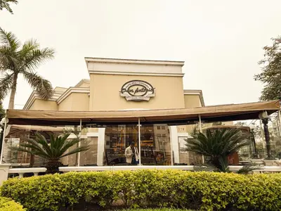 a man standing in front of a building at New 2D with Pool-Coworking-Gym in Miraflores in Lima
