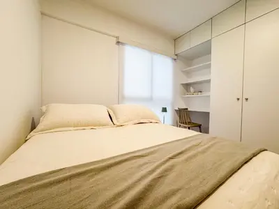 a bedroom with a large bed and a window at New 2D gym-grill Miraflores 1 block Malecón in Lima