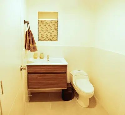 a bathroom with a toilet and a sink at Charming San Isidro Stay in Lima