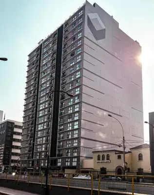 a tall building with a sign on the side of it at Charming San Isidro Stay in Lima