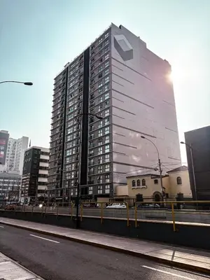 a tall building in the middle of a city at Charming San Isidro Stay in Lima
