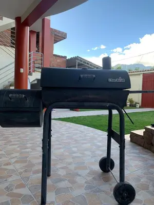 a bbq grill sitting on top of a patio at Casa de Campo en el Valle Sagrado de los Incas - Casa Brisas del Rio Sagrado in Huayllabamba