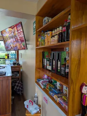 a room with shelves filled with bottles of alcohol at TUMI Specialty Travel in Colcapampa