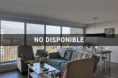 a living room with a no descriptive sign on the window at Habitación acogedora in Lima