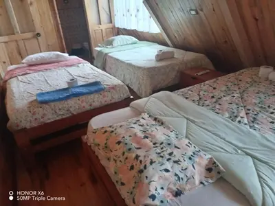 a bedroom with two beds at Cabaña VALLE ENCANTADO