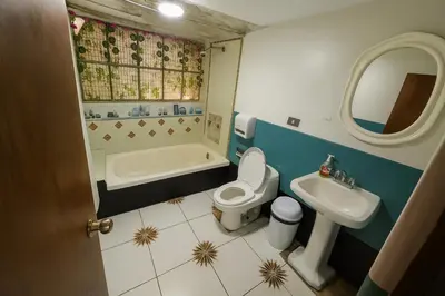 a bathroom with a toilet and a sink at Casa Victoria