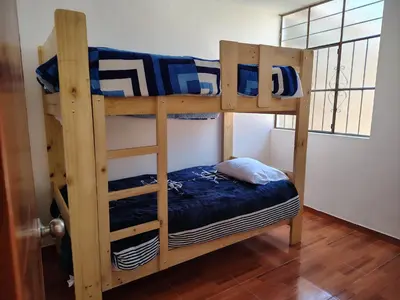 a couple of bunk beds in a room at Family Days in Ica