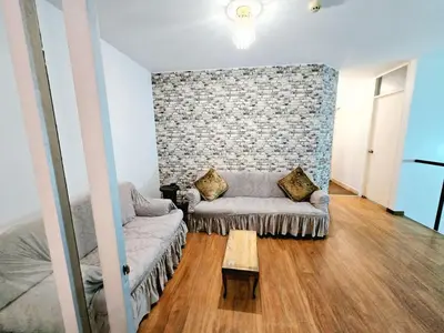 a living room with a couch and a table at barranco apartament R&M in Lima