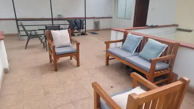 an overhead view of a room with chairs and a table at Duplex en San Borja in Lima