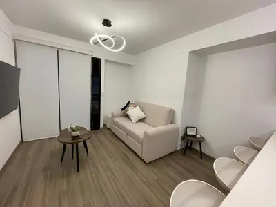 a living room with a couch and a table at Brand new apartment in Miraflores in Lima