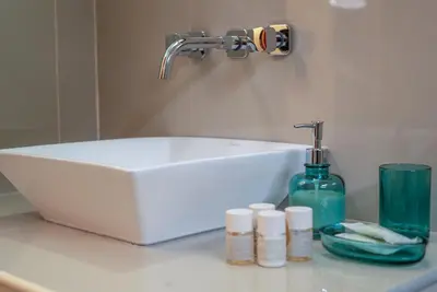 a white sink on a counter in a bathroom at Hotel Villarma in Alis