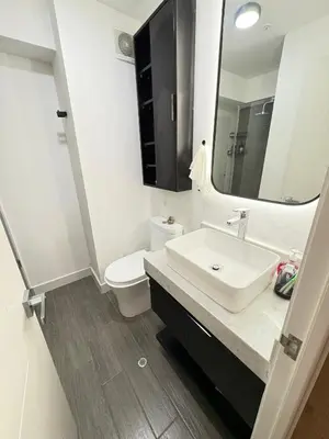 a bathroom with a sink and a toilet and a mirror at San Isidro Financial Flat Lima in Lima