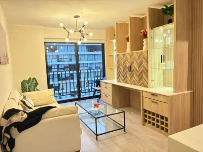 a living room with a couch and a glass table at San Isidro Financial Flat Lima in Lima