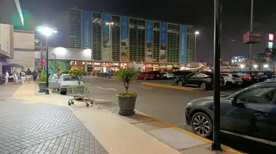 a car parked in a parking lot at night at HK5 Bed And Breakfast Apartment in Lima