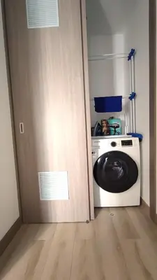 a door open to a laundry room with a washing machine at Beautiful and quiet aparment, near to Larcomar, cliff, Kennedy Park in Lima