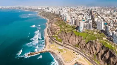 an aerial view of a city and the ocean at Beautiful and quiet aparment, near to Larcomar, cliff, Kennedy Park in Lima