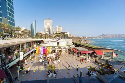 an overhead view of a city with people and the ocean at Beautiful and quiet aparment, near to Larcomar, cliff, Kennedy Park in Lima