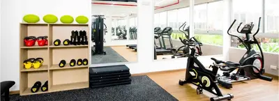 a gym with two exercise bikes and a mirror at Depa moderno y ejecutivo en estreno, cerca de San Isidro y Miraflores - nómada in Lima