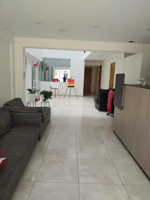 a large living room with a couch and a table at Hotel Rodilla in Ayacucho