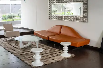 a living room with a couch and a table at Departamento Athelier in Lima