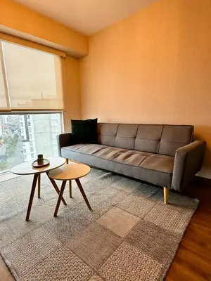 a living room with a couch and a table at Departamento Lock in Lima