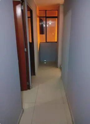 an empty hallway with a corridorngthngthngthngthngthngthngthngthngthngth at Departamento minimalista in Lima
