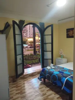 a bedroom with a bed and an open door at Hospedaje el señorial in Lima
