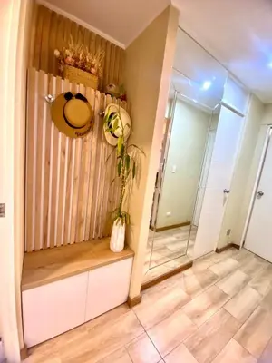 a hallway with a room with a shower and a mirror at Lovely apartment in front of malecon! in Lima