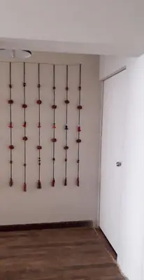 a room with a wall with a bunch of objects on the wall at Mica&Tory in Cusco