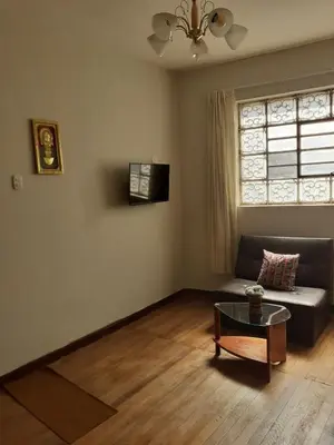 a living room with a couch and a table at Mica&Tory in Cusco