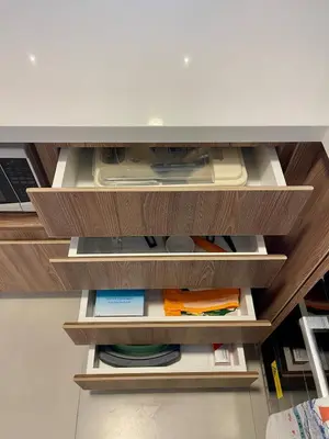 an open drawer with papers and other items on it at Calm and Cozy Flat in San Borja in Lima