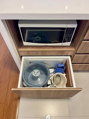 a drawer in a kitchen with a microwave at Calm and Cozy Flat in San Borja in Lima