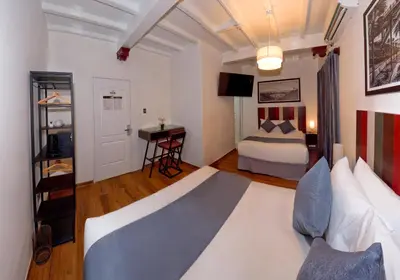 a hotel room with a bed and a desk at Casa Atempo Boutique Hotel in Lima