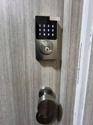 a lock on a door with a remote control at Departamento Salaverry in Lima