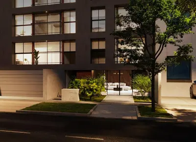 a black building with a tree in front of it at TyB apartment in Lima